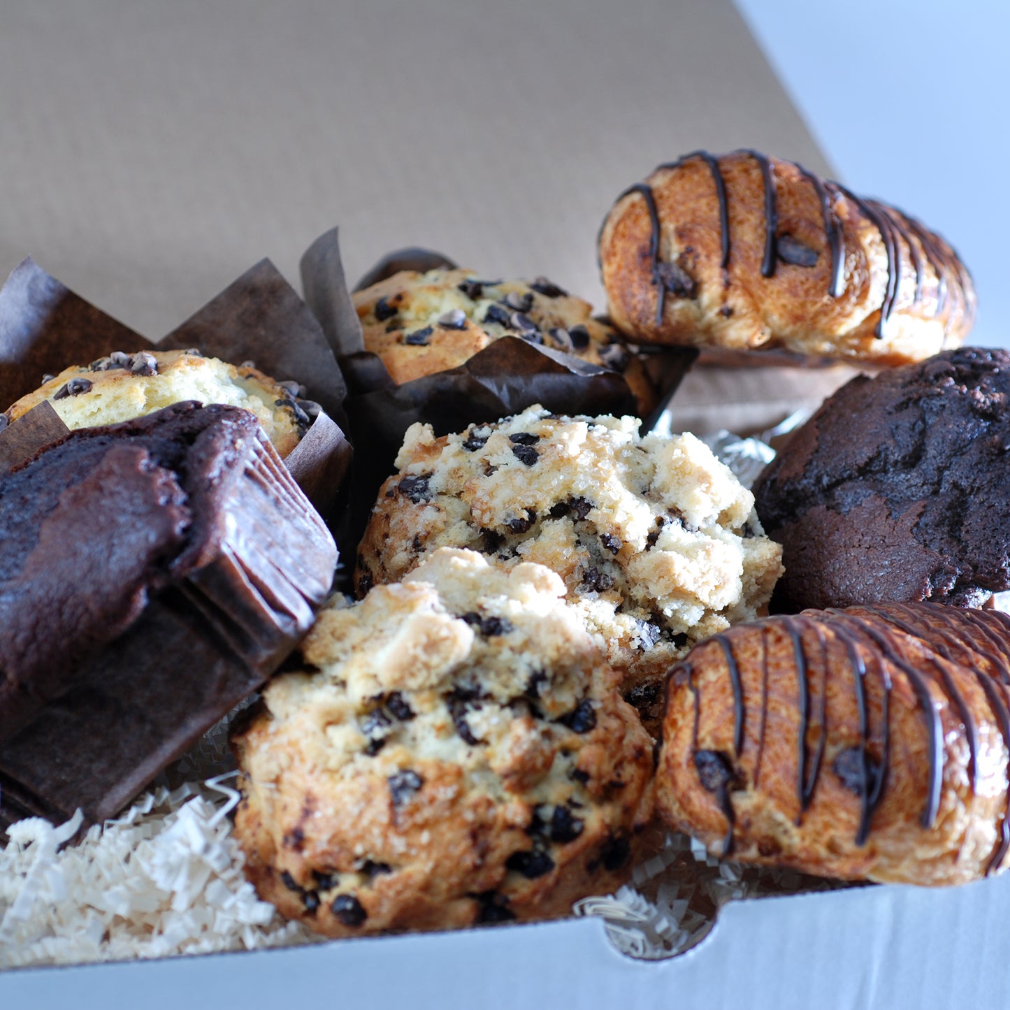 chocolate breakfast pastries croissants, muffins and scones in a gift box