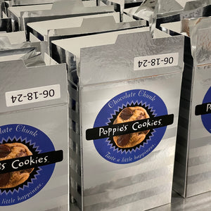 crispy chocolate chunk cookies in decorative silver boxer